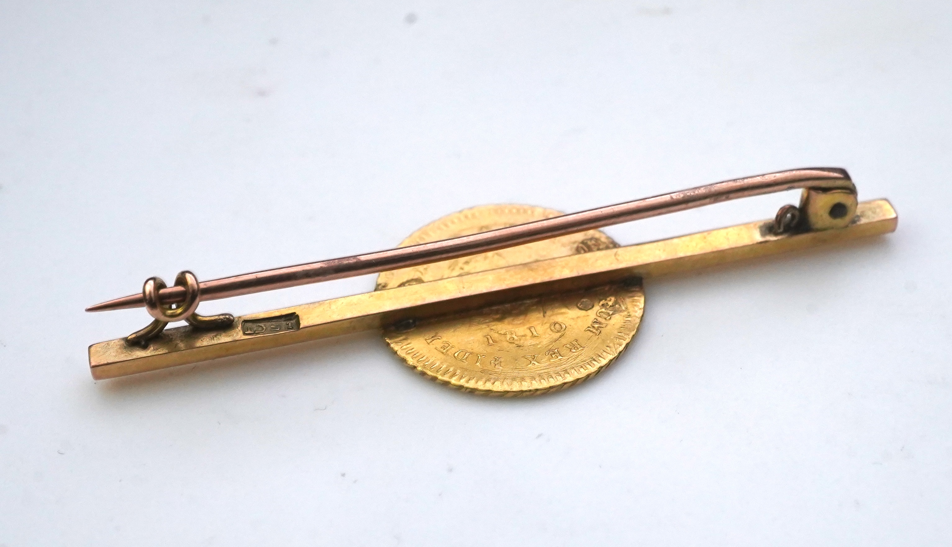 Seven assorted mounted or drilled gold coins